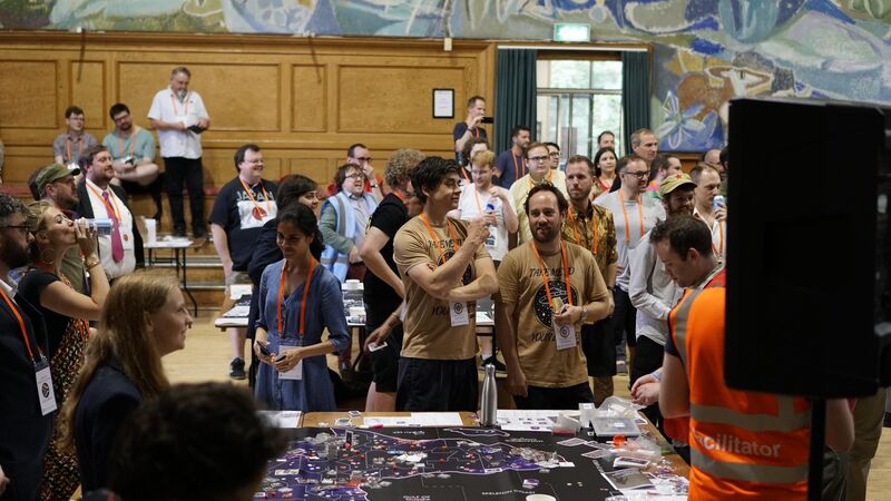 Players engaged in a large-scale megagame event