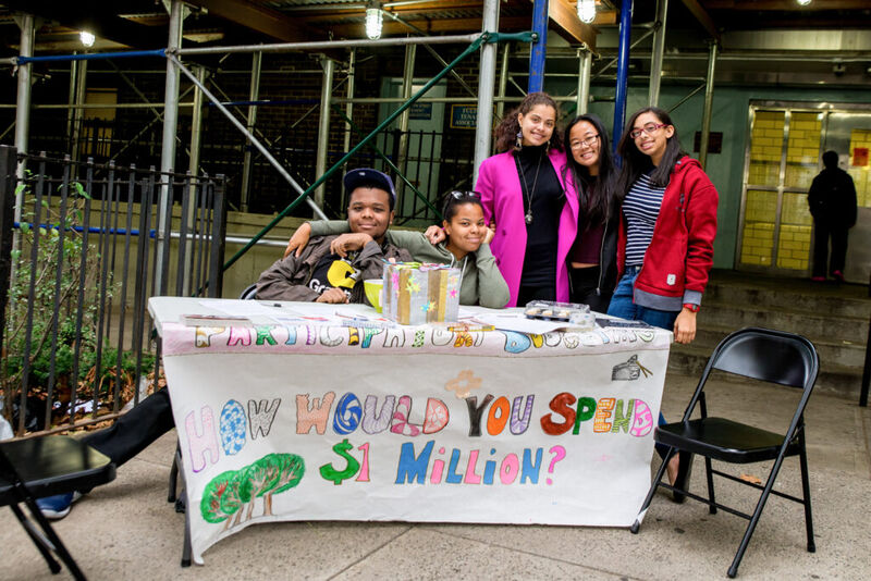 Community members engaging in participatory budgeting process