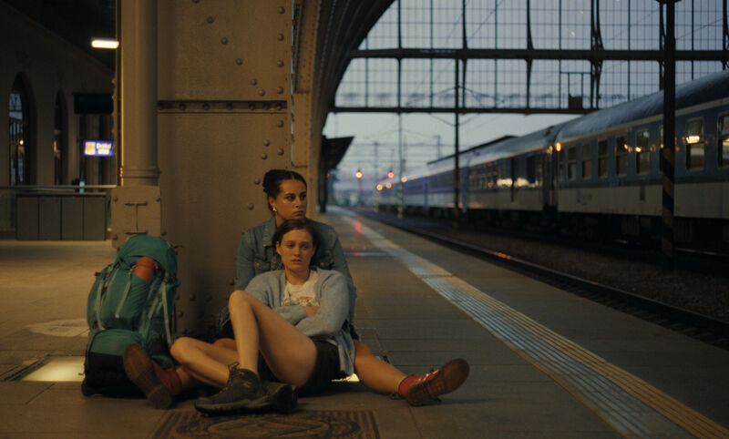 Backpackers on a train platform in Sweden